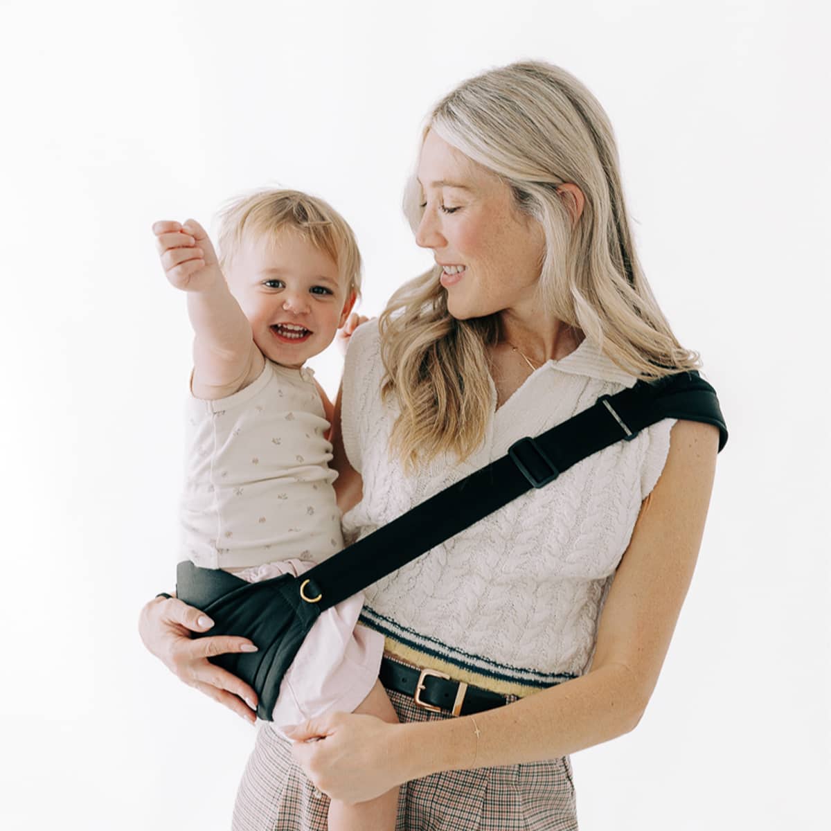 woman holding toddler in liftoff toddler sling