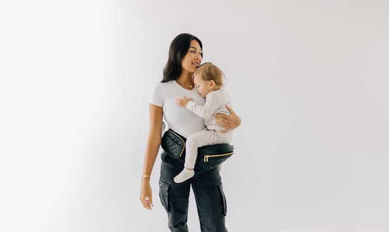 dealing with cling toddler using tushbaby hip carrier